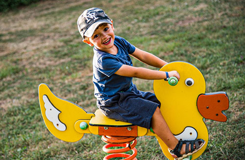 Outdoor games for children at the Parc du Charouzech campsite in Aveyron