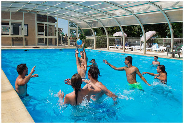 The swimming pool of the Parc du Charouzech campsite in Aveyron